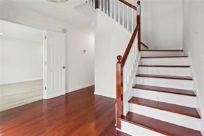 stairs with wood finished floors