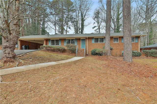 single story home featuring a carport