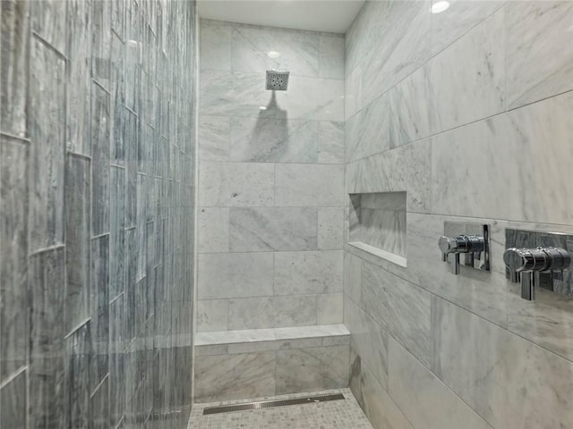 full bath featuring a tile shower