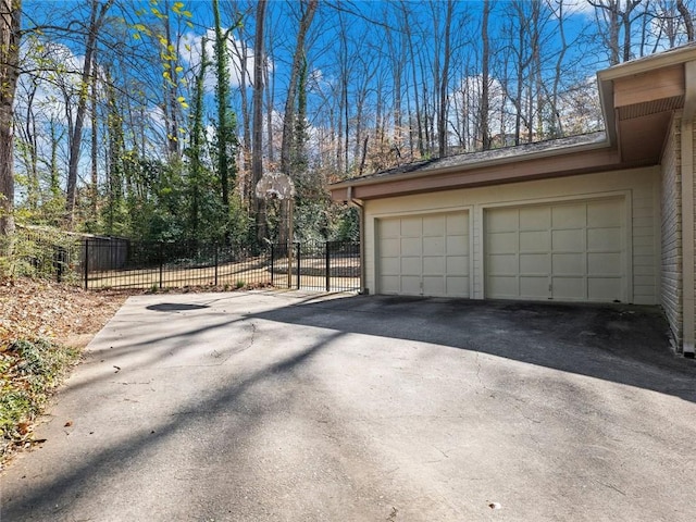 garage featuring fence