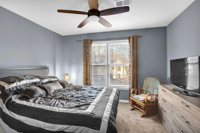 carpeted bedroom with ceiling fan