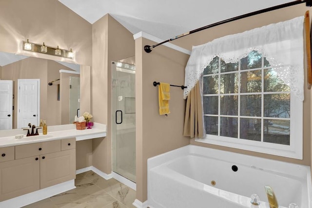 bathroom featuring shower with separate bathtub and vanity