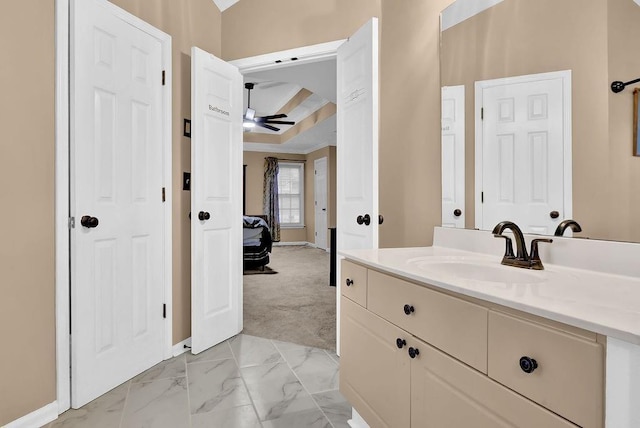 bathroom with ceiling fan and vanity