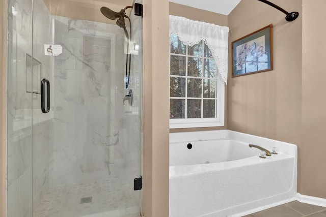 bathroom with tile patterned floors and plus walk in shower