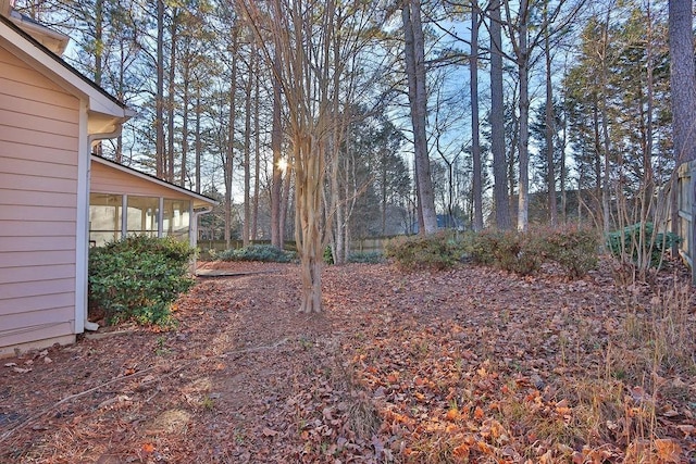 view of yard featuring a sunroom