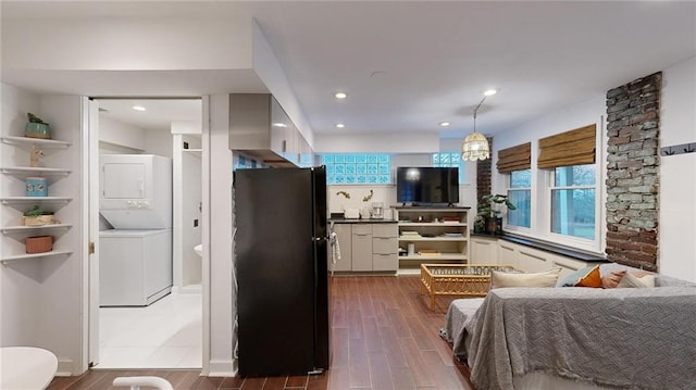 interior space with stacked washer / drying machine