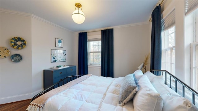 bedroom featuring ornamental molding and dark hardwood / wood-style floors