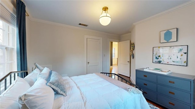 bedroom with crown molding