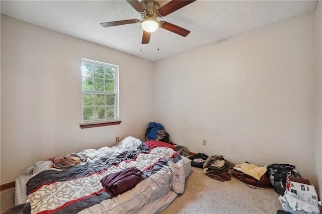 bedroom with ceiling fan and carpet