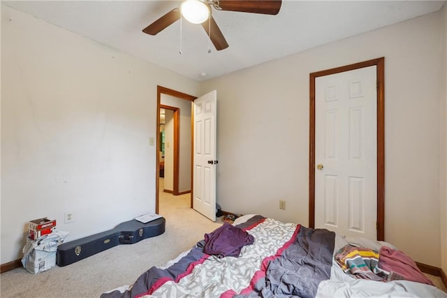 bedroom with ceiling fan and light colored carpet