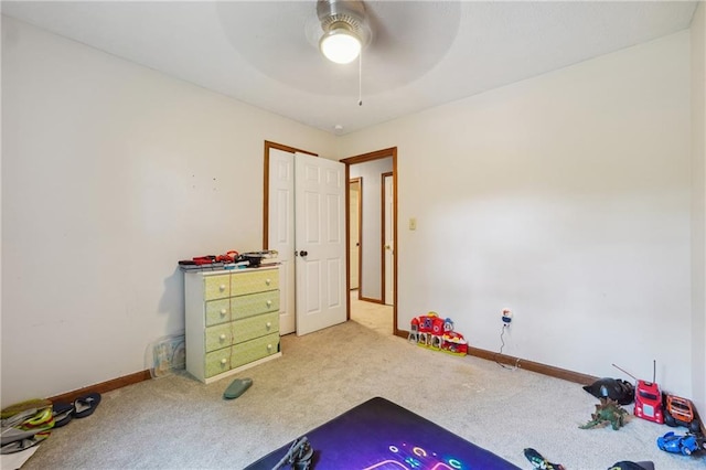 playroom featuring ceiling fan and light colored carpet