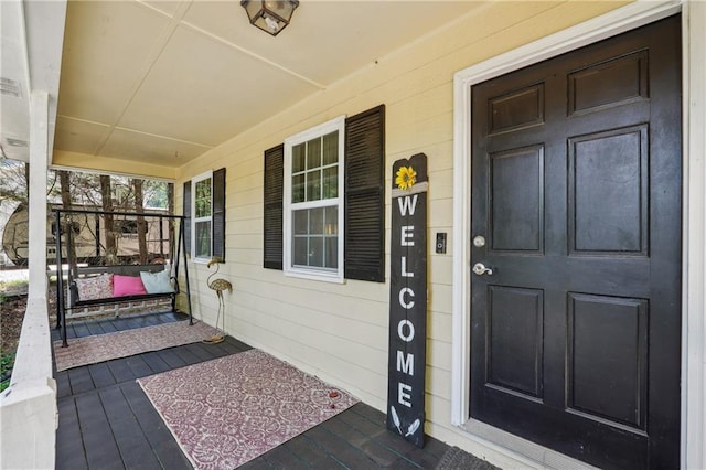 doorway to property with a porch