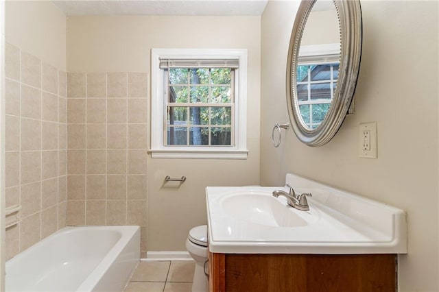 full bathroom featuring tile patterned flooring, vanity, toilet, and tiled shower / bath