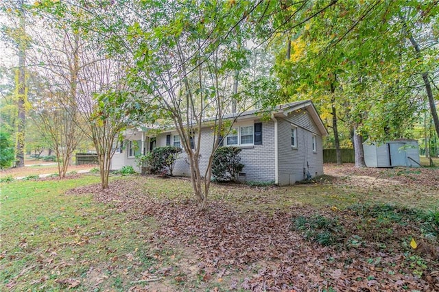 ranch-style home with a shed