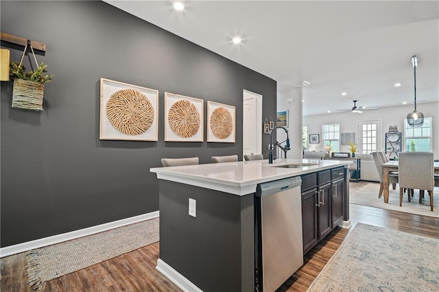 507 Bishop Ln, Woodstock, GA 30188 - kitchen with a sink, stainless steel dishwasher, open floor plan, a ceiling fan, and light countertops