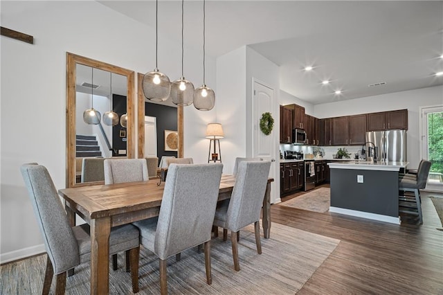 507 Bishop Ln, Woodstock, GA 30188 - dining space featuring stairs, wood finished floors, and recessed lighting