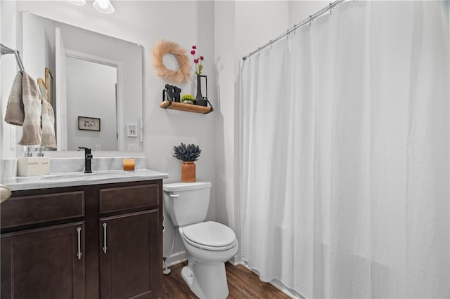 507 Bishop Ln, Woodstock, GA 30188 - bathroom with wood finished floors, toilet, and vanity