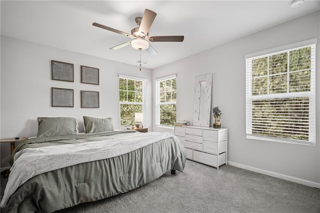 507 Bishop Ln, Woodstock, GA 30188 - bedroom with baseboards, light carpet, and ceiling fan