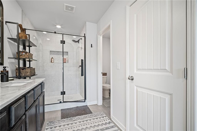 507 Bishop Ln, Woodstock, GA 30188 - full bath with a stall shower, toilet, vanity, and baseboards