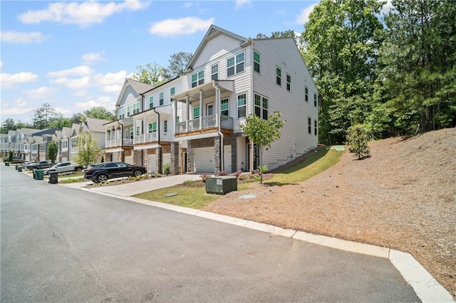 507 Bishop Ln, Woodstock, GA 30188 - view of property featuring a garage, a residential view, and driveway