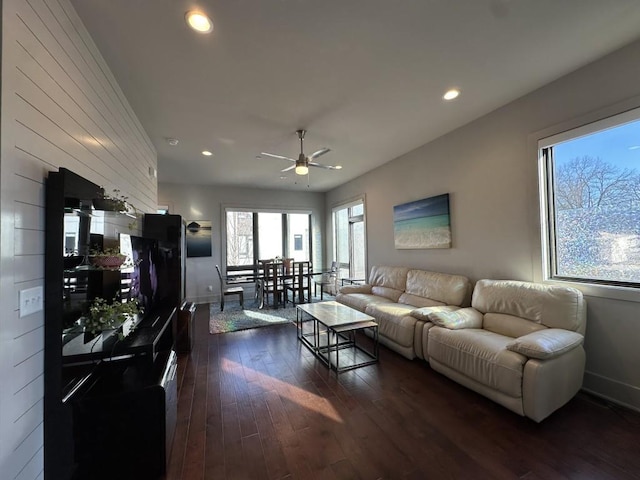 living room featuring dark wood-style floors, recessed lighting, baseboards, and a ceiling fan