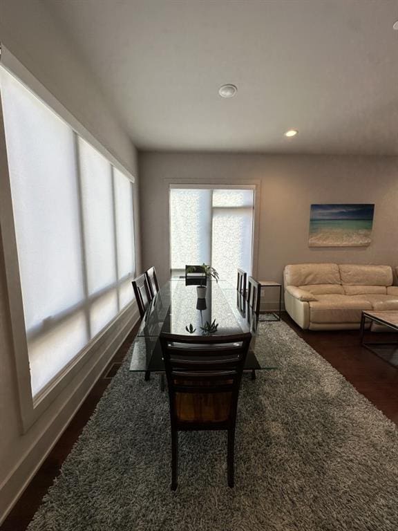 dining area featuring dark wood-style floors, recessed lighting, and baseboards