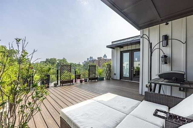 deck featuring an outdoor living space and french doors