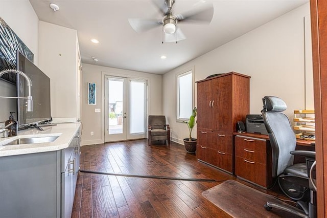 home office featuring a sink, french doors, baseboards, ceiling fan, and dark wood-style flooring