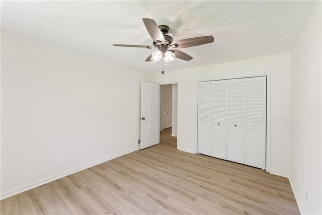145 Devilla Trce, Fayetteville, GA 30214 - unfurnished bedroom featuring light wood-style floors, baseboards, a closet, and ceiling fan