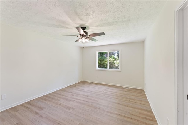 145 Devilla Trce, Fayetteville, GA 30214 - empty room featuring ceiling fan, a textured ceiling, light wood-type flooring, and baseboards