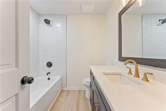 145 Devilla Trce, Fayetteville, GA 30214 - bathroom featuring vanity, wood finished floors, washtub / shower combination, and toilet