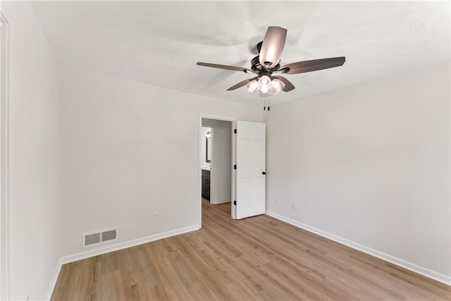 145 Devilla Trce, Fayetteville, GA 30214 - empty room with light wood finished floors, a ceiling fan, and baseboards