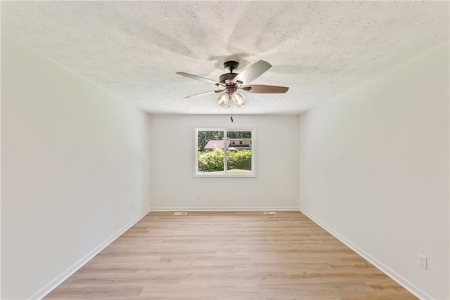 145 Devilla Trce, Fayetteville, GA 30214 - unfurnished room featuring ceiling fan, a textured ceiling, light wood-style floors, and baseboards