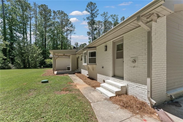 145 Devilla Trce, Fayetteville, GA 30214 - doorway to property featuring a lawn and brick siding