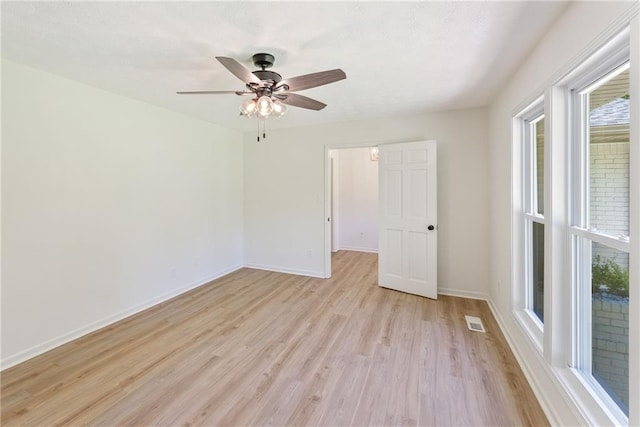 145 Devilla Trce, Fayetteville, GA 30214 - unfurnished room featuring light wood-style floors, baseboards, and ceiling fan