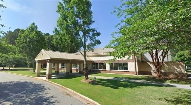 view of home's community with a lawn