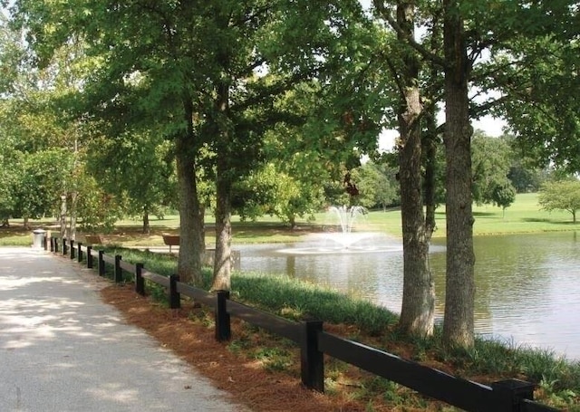 view of community with a water view