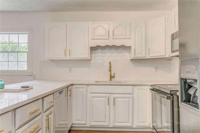 53 Knight Dr, Cedartown, GA 30125 - kitchen featuring range with electric stovetop, white cabinets, light countertops, and white dishwasher