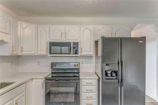 53 Knight Dr, Cedartown, GA 30125 - kitchen with black appliances, white cabinetry, light countertops, and tasteful backsplash