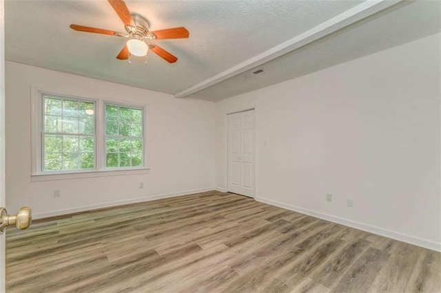 53 Knight Dr, Cedartown, GA 30125 - empty room with wood finished floors, a ceiling fan, and a textured ceiling