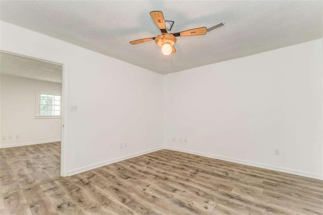 53 Knight Dr, Cedartown, GA 30125 - unfurnished room featuring wood finished floors, ceiling fan, and a textured ceiling