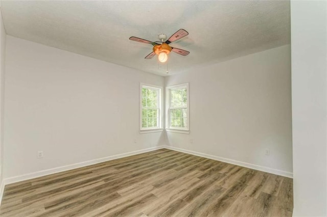 53 Knight Dr, Cedartown, GA 30125 - unfurnished room featuring wood finished floors, ceiling fan, and a textured ceiling
