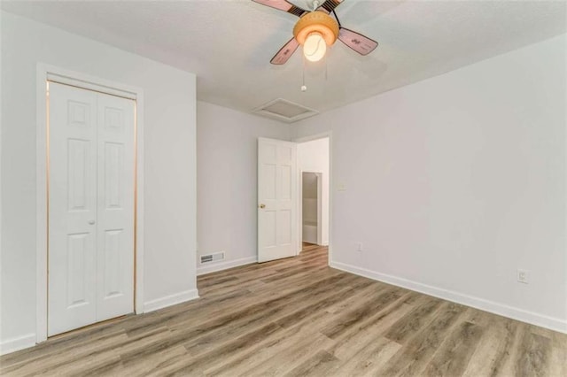 53 Knight Dr, Cedartown, GA 30125 - unfurnished bedroom with attic access, wood finished floors, a closet, and ceiling fan