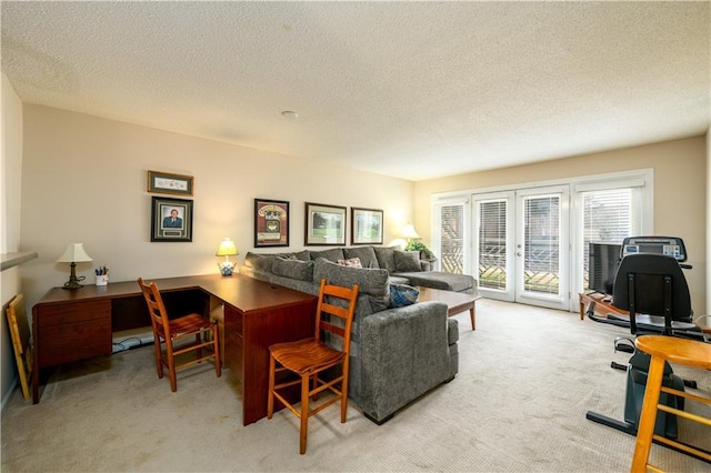 carpeted living room with a textured ceiling and french doors