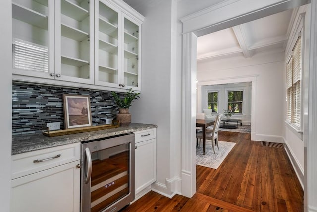 1038 Saint Charles Ave, Atlanta, GA 30306 - bar area featuring wine cooler, backsplash, dark wood-style flooring, beamed ceiling, and baseboards