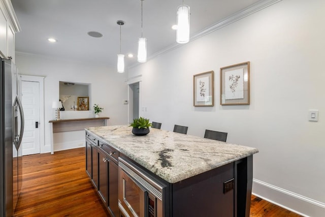 1038 Saint Charles Ave, Atlanta, GA 30306 - kitchen with appliances with stainless steel finishes, ornamental molding, a center island, dark wood-style floors, and baseboards