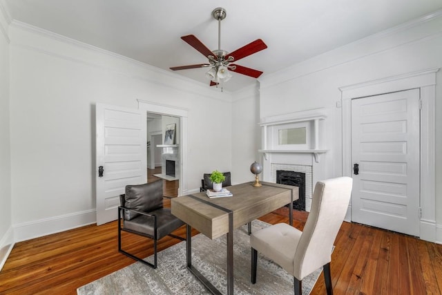 1038 Saint Charles Ave, Atlanta, GA 30306 - home office featuring a fireplace, a ceiling fan, ornamental molding, wood finished floors, and baseboards