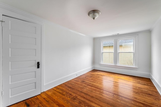 1038 Saint Charles Ave, Atlanta, GA 30306 - unfurnished room featuring crown molding, baseboards, and wood finished floors