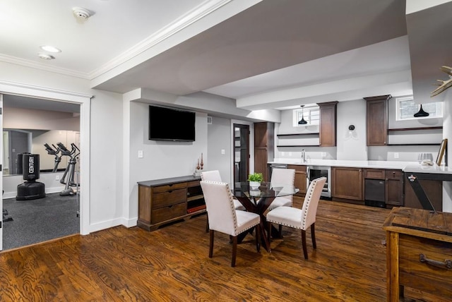 1038 Saint Charles Ave, Atlanta, GA 30306 - dining area with wine cooler, ornamental molding, dark wood finished floors, baseboards, and bar