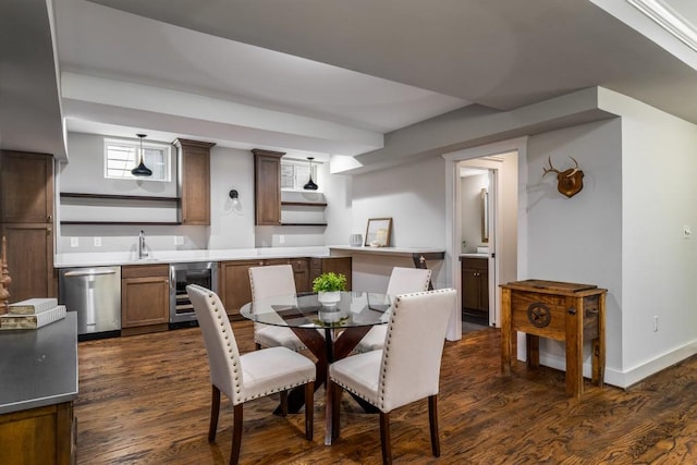1038 Saint Charles Ave, Atlanta, GA 30306 - dining area featuring wine cooler, wet bar, dark wood-style floors, and baseboards